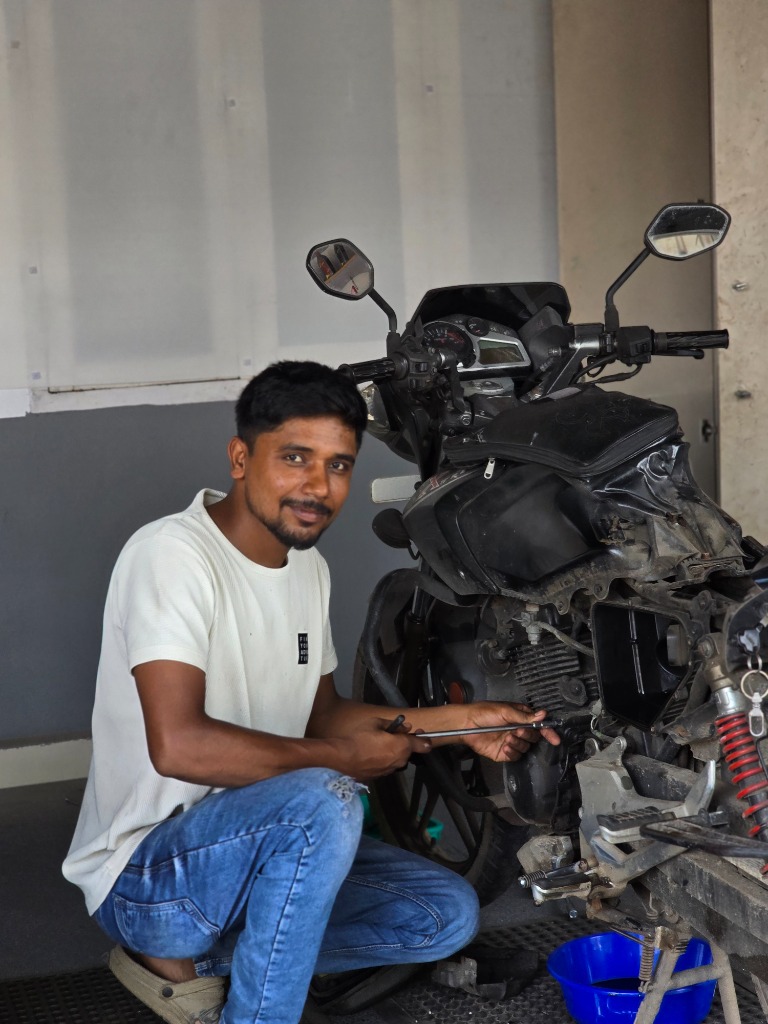 Experienced technician working on a motorcycle engine and gear alignment
